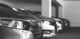 grayscale photo of car on road